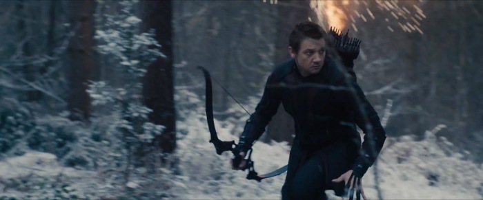 Hawkeye runs through what looks like the Forrest surrounding Baron Strucker's castle in what is likely Germany or another European country.