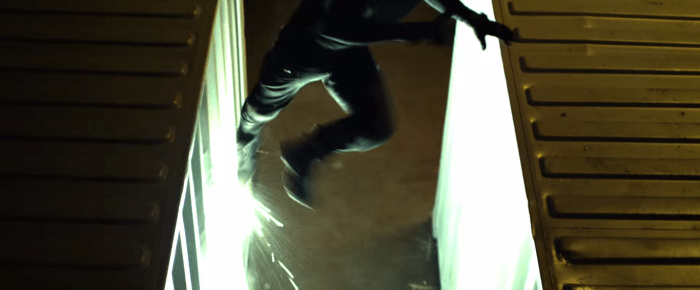 Doesn't this all look familiar? Hunting bad guys around shipping containers. Disappearing in the shadows. Only, NOW WITH PARKOUR!